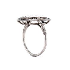 Vintage Diamond Onyx Cocktail Ring in Platinum. This antique Art Deco cocktail ring features 3.37 carats of Old European cut diamonds set in platinum and surrounded by pieces of square cut onyx. The three diamonds sit north-south along the finger in milgrain adorned bezel settings that appear to be floating inside their onyx frames. This ring is a great example of the fabulous angular style of the Art Deco era and is a perfect piece to accompany you to any cocktail party. Formal Square Cut Diamond Ring With Rose Cut Diamonds, Silver Platinum Art Deco Halo Ring, Square Cut Platinum Rings With Diamond Accents, Square Cut Diamond Platinum Rings, Silver Platinum Halo Ring, Art Deco Style, Art Deco Platinum Halo Ring In Silver, Art Deco Silver Platinum Halo Ring, Fine Jewelry Square Cut Single Diamond Rings, Timeless Square Cut Ring With Single Cut Diamonds