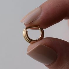 This 14k gold filled triple stacked septum ring is the perfect statement ring for everyday wear. It is lightweight and the straight pin makes for a very comfortable fit. Much flashier than our regular simple septum rings, and but still minimal in style and function. This ring is only available in 16 gauge. When putting this ring in, we recommend bending the pin up at an angle, and use your thumb to push the pin back down to create the horseshoe desired shape. This ring is not hinged, you must be 14k Gold Huggie Rings For Everyday, Small Hoop 14k Rose Gold Rings, Everyday 14k Gold Huggie Rings, Dainty Tarnish-resistant Huggie Rings, Hypoallergenic 14k Gold Huggie Rings, Everyday Stackable Huggie Rings, Gold Small Hoop Septum Ring Stackable, Gold Small Hoop Stackable Septum Ring, Gold Septum Ring For Everyday Wear