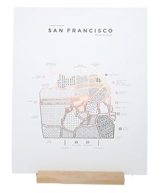 the san francisco map is mounted on a wooden stand with a white background and wood base