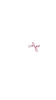 an airplane flying in the sky with a pink bow on it's tail