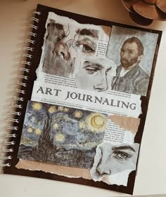 an art journal is open on top of a table