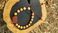 +. God Bless You. +. This is a Wooden Rosary Bracelet. +. It is knotted bracelet and it is adjustable . +. The crufix is carved in elevorate and three dementional shape. +. Beads are not round but beautifully angled. +.+.+.+.+. Materials +.+.+.+.+.+. Cross: Surinam Ebony Beads :olive tree +.+.+.+.+. Size +.+.+.+.+. Cross : 13.3mm(Width) *20mm(Height) Beads: 8mm +. Engraved characters(e.g. baptismal name, name,etc) on back side. It's Free engraving +. please send me characters that you want. +.Wo Adjustable Brown Rosary Bracelet For Meditation, Spiritual Brown Rosary Bracelet For Gift, Handmade Brown Rosary Bracelet As Gift, Catholic Rosary Bracelet, Knotted Rosary, Mens Rosary, Wooden Rosary, Knotted Bracelet, Catholic Cross