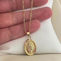 *Available In 2 Lengths: 18 Inches Or 20 Inches* New! Beautiful Gold Our Lady Of Guadalupe Necklace. Lovely Detailing & Shine! Our Jewelry Is Crafted With 10 Layers Of Solid 18k Gold Water Resistant Won’t Tarnish/Change Color Hypoallergenic Nickel Free 18 Inches Or 20 Inches Long Base Metal: Brass Composition: 18k Gold Filled Color: Gold Brand New In Box *Hablamos Espaol* Mexican Eagle Gold Necklace, Necklace Of God, Diamond Virgin Mary Necklace, Virgin Mary Necklace The Catholic Company, Necklaces Guadalupe, M Gold Necklace, Gold Pendant Jewelry God, Latina Gold Jewelry, Gods Necklace