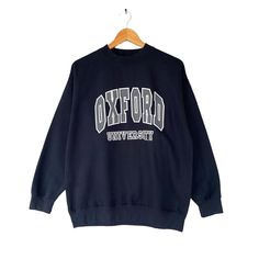 Vintage Oxford University Navy Sweatshirt Size Medium Oxford University Crewneck Oxford University Sweater Pullover Print Logo Oxford Jumper by brixtonclothing on Etsy Vintage Sweater With Letter Print And Long Sleeves, Vintage Long Sleeve Sweater With Letter Print, Winter College Sweatshirt With Ribbed Collar, College Winter Sweatshirt With Ribbed Collar, Winter College Tops With Ribbed Collar, College Sweater With Letter Print And Long Sleeves, Fall Campus Crew Neck Tops, Crew Neck Sweater For College In Winter, Crew Neck Tops For Campus Fall Season