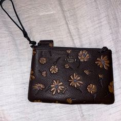 Coach Floral Wristlet, Never Used Brown Clutch With Removable Pouch, Coach Brown Bag As Gift, Coach Brown Bag As A Gift, Coach Brown Bag For Gift, Brown Clutch Pouch With Wrist Strap, Brown Textured Leather Clutch For Daily Use, Brown Clutch Wristlet For Everyday Use, Brown Wristlet With Removable Pouch As Gift, Brown Clutch Wristlet