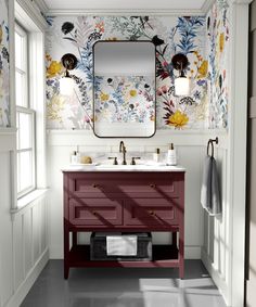 a bathroom with floral wallpaper and two sinks