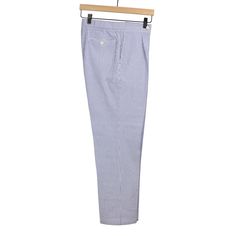 "We introduced last year our new pleated easy-pant style with Rota. Born from our needs for more casual fits, and more relaxed trousers. Something to wear with knitted tees or an breezy shirt. All the sartorial beauty of Rota's classic trousers with the comfort of elasticized trousers. This seasonal version in a blue striped seersucker cloth with a comfortable pleated top block, is a great take on the Ivy classic with extra oomph and comfort."---Greg Details 100% cotton , 240g weight Single-plea Summer Business Casual Cotton Pants, Summer Business Casual Relaxed Fit Chinos, Spring Blue Cotton Chinos, Blue Cotton Chinos For Spring, Cotton Pants With Welt Pockets For Daywear, Classic Relaxed Fit Chinos For Summer, Classic Blue Summer Pants, Classic Cotton Pants For Daywear, Casual Blue Seersucker Bottoms