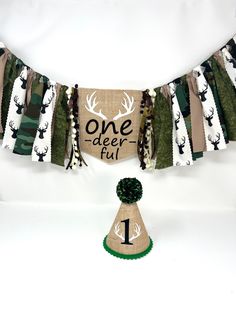 a burlock banner with the words one deer full on it and a green tree top