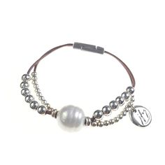 Two Strand Leather and Bead Bracelet with Magnetic Clasp and Large Freshwater Pearl- Length: 7.5"- Pearl: 15mm Elegant Leather Beaded Bracelets As Gift, Elegant Silver Leather Bracelet, Elegant Leather Beaded Bracelets With Adjustable Fit, Chic Adjustable Pearl Bracelet With Charm, Elegant Beaded Leather Bracelet, Elegant Leather Beaded Bracelets, Chic Adjustable Pearl Bracelet With Pearl Charm, Elegant Beaded Leather Bracelets, Elegant Beaded Leather Bracelet Gift