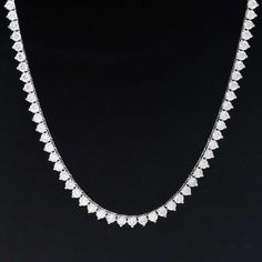 A classic diamond tennis necklace in white gold, with sparkly round brilliants sure to spruce up your neck stack! Each diamond sits in three prongs, all uniform in size, incredibly bright and white in color. We love the subtle touch of yellow gold that peaks through, making it the perfect piece to dress up any outfit. 14kt white gold 16.6" in length Diamonds are estimated to be colors & clarities. GIA Standards Please see qualitative report for more information. Dazzling White Tennis Necklace With Prong Setting, Classic White Tennis Necklace With Brilliant Cut, Classic White Tennis Necklace Brilliant Cut, Luxury White Cubic Zirconia Tennis Necklace, Diamond White Tennis Necklace With Diamond Cut, Luxury White Diamond Cut Tennis Necklace, White Brilliant Cut Cubic Zirconia Tennis Necklace, White Diamond Necklace With Single Cut Heart Shaped Diamonds, Luxury Single Strand Cubic Zirconia Tennis Necklace