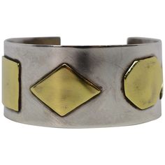 A fabulous artisan style piece, this cuff bracelet is made of .925 Sterling Silver and has contrasting Brass geometric appliques that bestows character and style. The mix metals cuff measures 2-1/4 inch by 2 inches and has an inside circumference of 7 inches including the one inch opening for an easy on and off. The width is 1-1/8 inch. In gift box. Yellow Gold Cuff Bracelet, Silver Bracelet Designs, Large Cuff Bracelet, Contemporary Bracelets, Diamond Cuff Bracelet, Crystal Cuff Bracelet, Pearl Cuff, Modernist Jewelry, Wide Cuff Bracelets