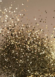 gold and silver glitters are flying in the air