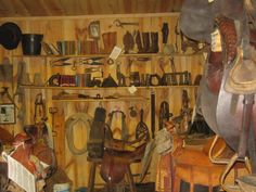 a room filled with lots of different types of saddles