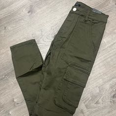 Sz: 32 High-rise Fall Pants With Multiple Pockets, High Rise Pants With Multiple Pockets For Fall, Khaki High Rise Stretch Pants, High Rise Stretch Khaki Pants, High Waist Green Pants With Multiple Pockets, Green Mid-rise Bottoms With Pockets, Green High-waisted Cargo Bottoms, Fall High Rise Cargo Pants, High Rise Fall Cargo Pants