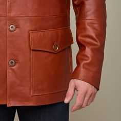 This rugged Safari Leather jacket is a vintage look that is sure to keep you warm while you brave the cold. Adorned with two upper pockets and two lower pockets, this piece enables you to pack as heavy or light in the cold as you like. Layer this Safari Jacket with a lightweight sweater or simple button down to achieve a dynamic look of western sophistication. Model is 6'1 and wearing size M. Classic Cognac Leather Jacket For Winter, Rugged Leather Jacket With Pockets For Winter, Fall Leather Outerwear With Multiple Pockets, Rugged Long Sleeve Sport Coat For Hunting, Winter Leather Utility Jacket With Pockets, Masculine Winter Leather Jacket With Pockets, Brown Utility Jacket With Lapel Collar And Pockets, Winter Leather Utility Jacket With Flap Pockets, Winter Brown Leather Jacket With Pockets