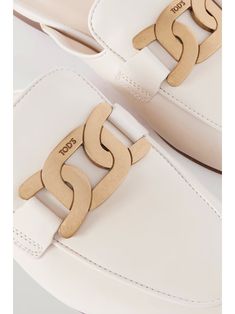 TOD'S Embellished leather slippers | NET-A-PORTER White Luxury Loafers For Formal Occasions, Luxury White Loafers For Formal Occasions, Designer White Formal Loafers, Luxury White Formal Loafers, Elegant Gold Mules For Workwear, Elegant Cream Slip-on Mules, Luxury Gold Calf Leather Loafers, Luxury Gold Loafers In Calf Leather, Designer Gold Leather Mules