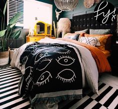 a bedroom with black and white striped flooring, green walls and an eyeball chandelier hanging from the ceiling