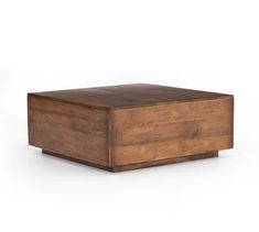 a wooden box sitting on top of a white surface