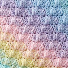 the crocheted blanket is multicolored and has two rows of different colors