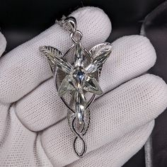 This gorgeous Arwen Evenstar necklace is just like the one she gifted to Aragorn in the Lord of the Rings trilogy. The Arwen pendant is made a high-quality S925 Sterling Silver, which means it will last through the ages. Plus, it comes with a free jewelry box! This Arwen Evenstar pendant is NOT made with cheap materials, like other Evenstar replicas you'll find. Similar Arwen pendants are made with silver toned zinc alloy, plated copper or even aluminum, which will fade over time or easily break Lotr Collection, Lord Of The Rings Necklace, Lotr Arwen, Evenstar Necklace, Aesthetic Diys, Arwen Evenstar, Lord Of The Rings Trilogy, The Lord Of The Rings, Hair Accessories Jewelry