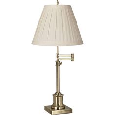 a table lamp with a white shade on it's base and a beige lampshade