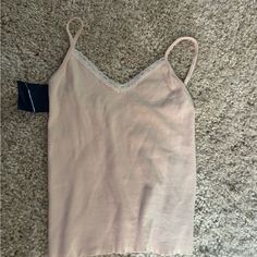 Nwt Pale Pink! Selling A Ton Of Other Brandy Melville In My Closet, Posting Throughout The Day So Feel Free To Check Back In And Make Bundles. Lots With Tags All New And Never Been Worn! Feminine Seamless V-neck Camisole, Beige V-neck Camisole With Built-in Bra, Sleeveless Seamless Tops For Daywear, Seamless Tank Top For Daywear, Seamless Sleeveless Top For Daywear, Feminine Cami Top For Loungewear, Feminine Stretch Cami Top, Feminine Camisole Tops For Loungewear, Beige Stretch Tops For Daywear