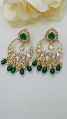 Elevate your elegance with the Tayani Kundan Chandbaali earrings, a perfect fusion of traditional craftsmanship and modern allure. These exquisite earrings are meticulously handcrafted, featuring intricate Kundan work that embodies the timeless beauty of Indian heritage. Features: Authentic Kundan Work: Each earring showcases intricate Kundan craftsmanship, with gemstones meticulously set to create a dazzling display of light and color. Elegant Design: The classic crescent moon shape, known as C Chaand Baaliyan Earings, Festive Fusion Hoop Earrings For Celebration, Chandbali Fusion Hoop Earrings For Celebration, Fusion Style Chandbali Hoop Earrings For Celebration, Heavy Fusion Chandbalis Drop Earrings, Fusion Style Tilla Chandbalis Drop Earrings, Festive Fusion Chandbali Bridal Earrings, Traditional Green Hoop Earrings For Wedding, Fusion Style Round Chandbalis With Cutdana