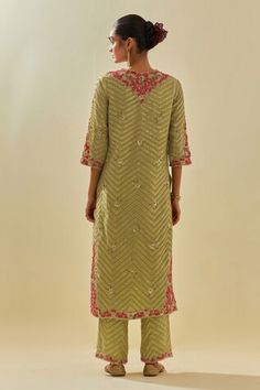 Green kurta featuring floral silk applique motifs and bead sequin embroidered chevron patterns. Comes with embellished pant, scalloped hem dupatta and inner slip. - Aza Fashions Spring Pista Green Kurta With Mirror Work, Spring Embroidered Silk Sharara, Embroidered Kurta For Spring Reception, Spring Reception Embroidered Kurta, Spring Georgette Set With Mirror Work, Pista Green Sharara With Floral Embroidery For Spring, Spring Traditional Wear With Mirror Work, Semi-stitched, Fitted Palazzo Set With Intricate Embroidery For Spring, Spring Pista Green Sharara With Floral Embroidery