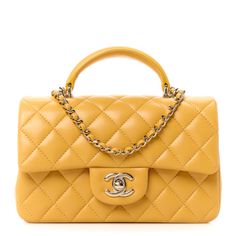 This is an authentic CHANEL Lambskin Quilted Mini Top Handle Rectangular Flap in Yellow. This chic petite shoulder bag is crafted of diamond quilted lambskin leather in yellow. The crossbody bag features a top handle, a long gold chain-link leather threaded shoulder strap and a frontal flap with a Chanel CC turn lock. The flap opens to an interior of smooth leather with zipper and patchpockets. Chanel Mini Rectangular, Classic Phones, Chanel Top, Chanel Crossbody, Chanel Tweed, Perfect Purse, Chanel Flap Bag, Chanel Mini, Chanel Shoulder Bag