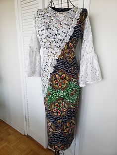 "Actual Measurements: M1:Bust 34/Waist 34/Hip 40/Length 36 L: Bust 36/Waist 34/Hip 42/Length 42 Fabric: Ankara 100% Cotton Very smooth to touch, and cool on the skin.  This Combined Ankara and Lace dress is an excellent addition to your Collection. Custom tailored with you in mind using the finest authentic African Ankara material  popularly known as \"Big Ankara\" I grew up wearing Ankara dresses and I can tell you that Ankara Materials are well known for their vibrant colors and patterns, as a White Stretch Bohemian Dress, Green Long Sleeve Dress With Traditional Patterns, White Patchwork Maxi Dress, Fitted Green Maxi Dress With Patchwork, Fitted Green Dresses With Traditional Patterns, Green Fitted Dresses With Traditional Patterns, Fitted Green Dress With Traditional Patterns, Fitted Patchwork Maxi Dress, Traditional Fitted Cotton Maxi Dress