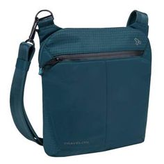 a blue cross body bag on a white background