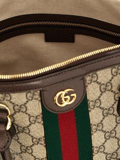 'Ophidia' handbag in GG Supreme fabric with leather details, logo and web ribbon application, double handle, zip closure, removable shoulder strap. Composition: 60% polyurethane 20% cotton 20% polyester Gucci Double Handle Satchel For Shopping, Gucci Satchel With Detachable Strap For Shopping, Gucci Satchel With Top Carry Handle For Shopping, Gucci Crossbody Satchel With Top Carry Handle, Gucci Crossbody Satchel, Gucci Double Handle Bags With Gold-tone Hardware, Gucci Top Handle Shoulder Bag, Gucci Bag With Zipper For Everyday Use, Gucci Bag With Zipper Closure For Everyday Use