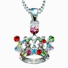 "PERFECT CHRISTMAS GIFT FOR LADIES You are getting a Princess / Queen Crown Pendant with Swarovski crystals. It comes with a FREE 16\" Original Rhodium Plated Snake Chain necklace with lobster clasp. Crown size is 1\" (2.5cm) wide X 7/8\" (2.2cm) high. Crystal Color: AQUA, JONQUIL, PERIDOT, CRYSTAL CLEAR, LIGHT AMETHYST, ROSE, LIGHT ROSE, SIAM RED Prices are in US$. For shipping policies and other important information, click on \"profile\" on the right. See an item that you like but has already Sparkling Crystal Rhinestone Necklace Gift, Crystal Jewelry For Christmas Party, Jeweled Crystal Rhinestone Necklace As Gift, Multicolor Rhinestone Crystal Necklace As Gift, Multicolor Jeweled Rhinestone Necklace For Gift, Multicolor Jeweled Rhinestone Necklace Gift, Silver Rhinestone Jewelry For Birthday, Crystal Rhinestone Necklace With Jewels As A Gift, Silver Crystal Jewelry With Crown Design