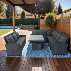 an outdoor living area with couches and tables