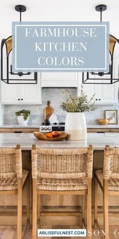 a kitchen with white cabinets and wicker chairs