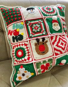 a crocheted christmas pillow on a couch