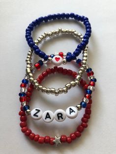 *This patriotic bracelet set can be customized to say any name or saying that you would like.* *Set Will come with all 4 bracelets as pictured.* **Please measure wrist before ordering.** **Please roll on bracelets rather than stretch on to prevent breaking.** Patriotic Kids, Patriotic Bracelet, Blue Stone Bracelet, Kids Bracelet, Stack Bracelets, Stack Bracelet, Corpus Christi Tx, Kids Bracelets, Roll On