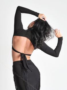 "Crop top for dancing with a high neck and an open back. The stylish top fits the figure well, and the drawstring emphasizes the waist. The belt can be tied on the front or back of the product, so you will be in a new look at every workout. The high neckline accentuates the neck and adds elegance to the look. INDIVIDUAL TAILORING If you want to change the style of clothes (shorten, make it longer, add a sleeve, etc.) you can order individual tailoring from us. You can also individually order ANY Chic Tie Back Crop Top For Party, Flirty Halter Neck Top For Evening, Cropped Tie Back Crop Top For Evening, Evening Cropped Crop Top With Tie Back, Fitted Tie Back Backless Tops, Stretch Tie Back Backless Top, Stretch Backless Top With Tie Back, Stretch Tie-back Backless Top, Fitted Tie Back Crop Top For Date Night