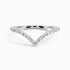 a white gold wedding band with pave set diamonds on the top and bottom half