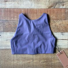 Girlfriend Collective Topanga Sports Bra In A Size Extra Small. Grayish Purple In Color. Halter Bra Style With Adjustable Straps. Can Also Wear Like A Crop Top. Low Impact Bra. Made From Recycled Water Bottles. Features: High-Neck A Low Back Adjustable Criss-Cross Straps Four-Way Stretch Condition: New With Tags Summer Sports Bra With Built-in Padding, Fitted T-back Activewear For Yoga, Casual Racerback Tops With Built-in Padding, Fitted T-back Crop Top For Yoga, Fitted Yoga Top With Built-in Padding, Casual Fitted T-back Crop Top, Fitted Tank Sports Bra With Built-in Padding, High Stretch T-back Tops For Sports, Casual Stretch Tops With Built-in Padding