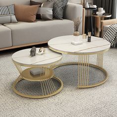 two tables sitting on top of a carpeted floor next to a couch and chair