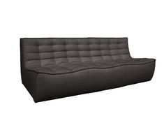 a black couch sitting on top of a white floor