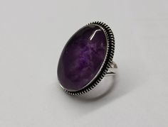 This Gorgeous Amethyst gems stone Ring, features a Boho Studded Pattern around the Genuine Cognac Color purple  Cabochon. The Border is lightly oxidized to show details and looks lovely with the Amethyst gemstone. All my gemstones are hand selected for best quality assurance, then precisely sawed, and shaped into the desired geometry. The precious stones are then delicately grinned, sanded and hand polished to make sure the jewelry have the perfect aesthetic. Amethyst Gemstone Ring, 92.5 Sterlin Aesthetic Amethyst, Perfect Aesthetic, Cognac Color, Amethyst Gem, Purple Band, Vintage Ring, Amethyst Gemstone, Amethyst Ring, Boho Rings