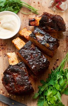 some meat is sitting on a cutting board