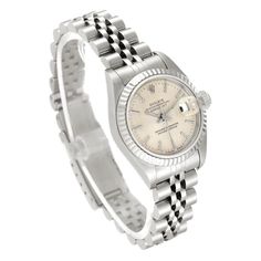 Women's Rolex 26mm DateJust Stainless Steel Watch with Silver Tapestry Dial and Fluted Bezel. Pre-Owned SN# 981**** Brand: Rolex. Gender: Ladies. Model: DateJust. Dial Color: Silver. Condition: Very Good. Model Number: 69174. Crystal: Sapphire Crystal. Case Dimensions: 26mm. Hour Mark: Non-Numeral. Metal Type: Stainless Steel. Bracelet / Strap: Jubilee Stainless Steel. Box / Certification: Rolex Box / Certificate of Authenticity. Warranty: One (1) Year Limited Service Warranty. 26mm Rolex Women, Rolex 26mm Women, Rolex Watches Women Silver, Rolex 28mm Women, Rolex Date Just 36 Women, Zenith Watches, Rolex Women, Rolex Watches Women, Rolex Yacht Master