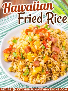 hawaiian fried rice with ham and vegetables on a white plate