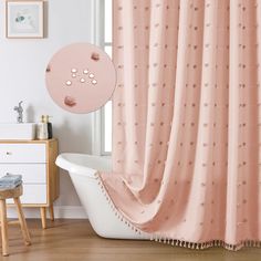 a bathroom with a bathtub and pink shower curtain