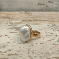 Ring with 18 Kt yellow gold plated silver and White baroque freshwater Pearl. Pearl: 2x1,7 cm The band measures 0,5 cm. Italian size 13 US size: 6,5 If you want another dimension you can contact me. As all my jewels, the ring is designed and handmade with love at my art lab in Umbria the heart of Italy. The ring is stamped with the mark 925. The ring will be sent to you in a beautiful gift box with a certificate of warranty. FREE SHIPPING  For Payment and Shipping Please read Shop Polices. Your item will be shipped via registered mail with tracking number. I ship all of my packages First Class or Priority Mail with tracking and insurance. Check out CHIARABATELIER on Instagram: chiara.b_prezioselaborazioni for new work previews, news and info on upcoming sales Classic Gold Pearl Ring With High Luster, Timeless Gold Pearl Ring, Classic Yellow Gold Plated Pearl Ring, Elegant White Pearl Ring Gold Plated, Classic Gold Pearl Drop Ring, Classic Gold Pearl Ring With Pearl Drop, Elegant Baroque Pearl Drop Ring, Gold Rings With Pearl Drop For Formal Occasions, White Open Ring With Pearl Charm