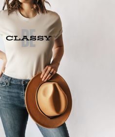 Embrace elegance and confidence with this "Be Classy" t-shirt. This graphic tee is a reminder that true class comes from within. Made from comfortable, high-quality material, this shirt is perfect for dressing up or down. It's a great gift for yourself or someone who values timeless style and inner beauty. Welcome to my design haven! I offer an eclectic mix of styles and sizes. Whether you're into vintage vibes, trendy designs, or timeless classics, I hope you find it all here. Browse through pages of neatly designed shirts, each one beckoning you to touch and explore. This Shirt Is Bella + Canvas Brand: * Retail fit * Unisex sizing * Shoulder taping * Side-seamed * Tear away label * Pre-shrunk WASHING INSTRUCTIONS: Machine wash: warm (max 40C or 105F); Non-chlorine: bleach as needed; Tumb Relaxed Fit Everyday T-shirt, Elegant Relaxed Fit T-shirt For Everyday, Classic Graphic Print Tops For Everyday, Classic Fitted Graphic T-shirt, Classic Everyday Tops With Graphic Print, Fitted Classic T-shirt With Graphic Print, Elegant Crew Neck Top With Graphic Print, Classic Everyday Tops With Text Print, Elegant White T-shirt For Everyday