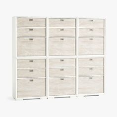 six drawers are stacked on top of each other in this white cabinet with wood handles